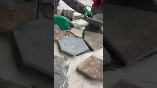 making floor tiles into irregular chunks of random ceramic tiles that give an aesthetic impression