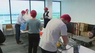 Volunteers pack 10,000 nutritious meals for local food banks
