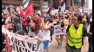 Anti-Trump protesters march through Chicago on Fourth of July