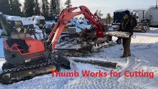 the New Hydraulic Thumb Holding the Firewood for Easy Cutting Jan 27 2026