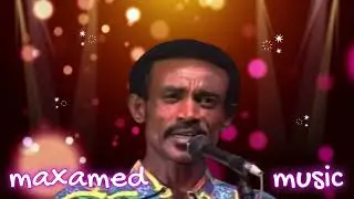Axmed Yaasiin Digfeer - Dayaxiyo Cadceedaa Doraad Layga Yeedhoo (Maxamed Remix)