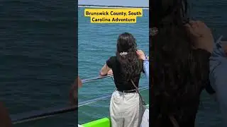 Mesmerizing Encounter: Dolphins Gracefully Gliding Beside Our Boat - Brunswick County, SC Adventure