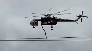 Red & white firefighter Sky crane helicopter taking off from the airport 