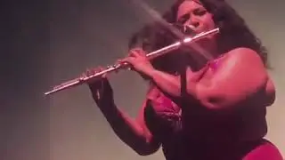 Lizzo playing flute like an angel