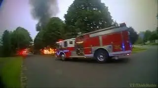 New body camera video shows police officers responding to house fire
