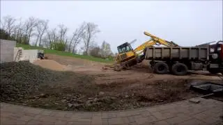 Menzi Muck 6000 unloading Tatra 815