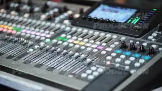 Professional digital audio mixer controlling sound levels for live music and events