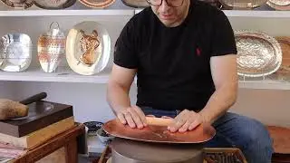 A handcrafted pomegranate plate made by David Miro and his son Dror
