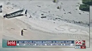 Two men picked up after aircraft spotted SOS written in the sand