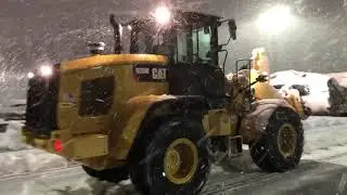 Cat 926M loader plowing wet heavy snow