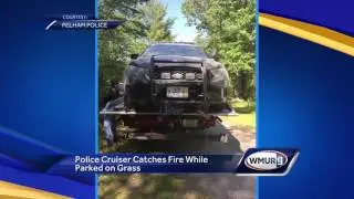 Police cruiser catches fire while parked on grass