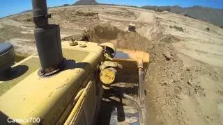 CAT D6D Dozer Pushing Dirt off a Cliff