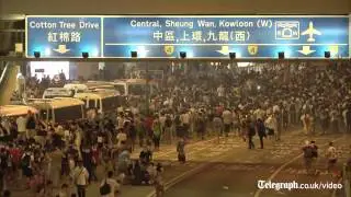 Hong Kong police resort to tear gas to break up democracy protesters