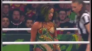 Mercedes Mone walks over people 