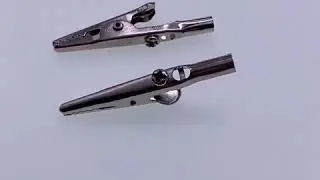 Alligator clip with metal single handle and screw
