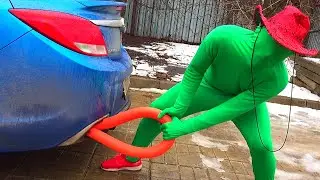 The Green Man can't start his Blue Sports Car.