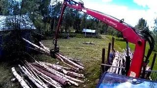 Unloading logs with old hydraulic forest crane