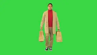 Man with Shopping Bags Happy Smiling on a Green Screen Chroma Key
