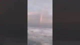We saw a RAINBOW FROM OUR PLANE WINDOW!!
