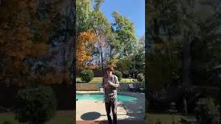 Guy drinking Ani by a pool