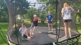 Melania Pearl Larson, 7-12-25, Jumping with cousins