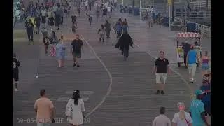 bicycle Batman loses his cape on Atlantic City boardwalk. no sound