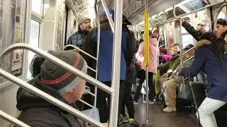 Confrontation Between Passengers on Crowded Metro Train Ride in New York City