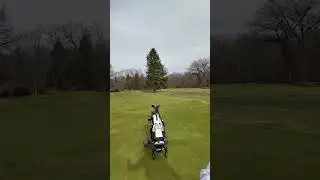 Walking up 18 with the Axglo e5 right behind me.