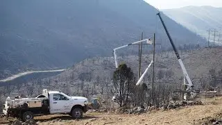 Power company working to permanently fix transmission lines damaged by Monroe Canyon Fire