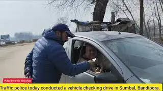 Traffic Police conducted a vehicle checking drive in Sumbal, Bandipora Licences and seat 