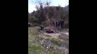 Head over heels in mud.