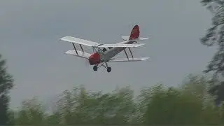 Biplane Aerobatics Over Lake
