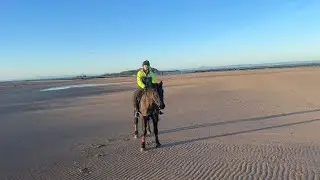 A New Year ride along the beach with reflection 