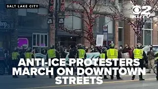 Several protestors taken into custody after refusing to leave street after march