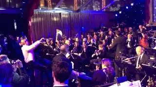 Charlize Theron conducting The Ron Jones Orchestra