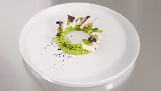 Cuttlefish, beans and black olives powder