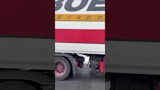Red Snowplow Truck Actively Clearing Snow and Spreading Salt