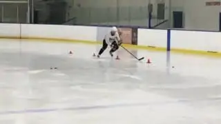 Pro Player Skating Over Cones - Quickly on Inside Edge