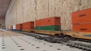 Slow HO scale CSX intermodel train passes a DT&I grain express train all athearn engines