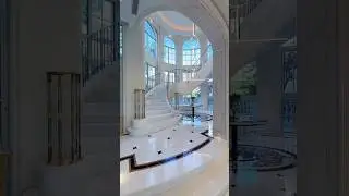 Stunning Marble Staircase with Elegant Glass Railing!