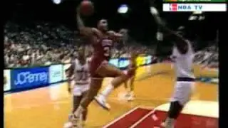 Sir Charles Barkley dunks over Manute Bol