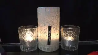 rawLight candle holders and vintage glass votives.