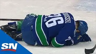 Antoine Roussel Helped Off Ice After Taking Brendan Lemieux Elbow To Head & Landing On Leg