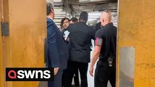 Photographer physically manhandled out of Tory conference | SWNS