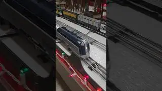 Reading Crusader Passenger train running on the o scale layout around the fire truck.