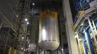 Teams hoist the SLS liquid oxygen tank into Cell D at NASA's Michoud facility