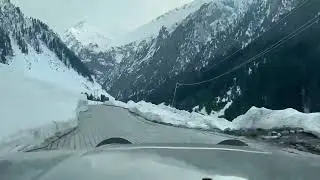 Scorpio at snow-covered Road somewhere in Kashmir Valley