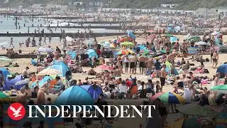 Bournemouth beach packed with sunbathers as temperatures hit 28C