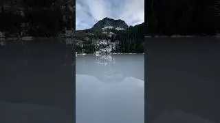 Standing in the middle of a tranquil frozen mountain lake deep in the forest.🏔️🌲