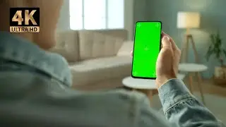 Mobile view of a man holding a hand green screen video | 4K Ultra HD